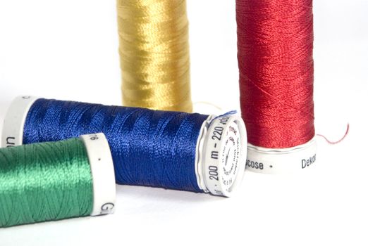 The image of four coils of Thread for a machine embroidery