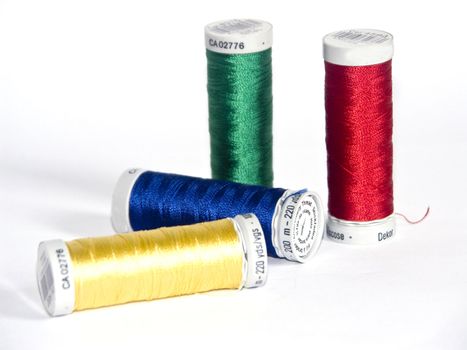 The image of four coils of Thread for a machine embroidery