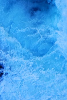 Close up of the foam of a breaking wave, suitable as a graphic background.