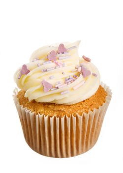 Cupcake decorated with frosting and purple sprinkles