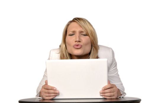 Happy Blond Woman Looking At A White Laptop