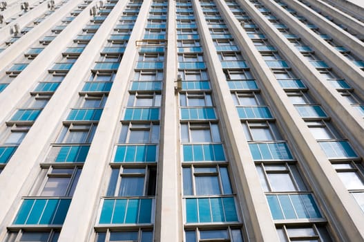 tall office building exterior, perspective pattern with windows, wide angle shot