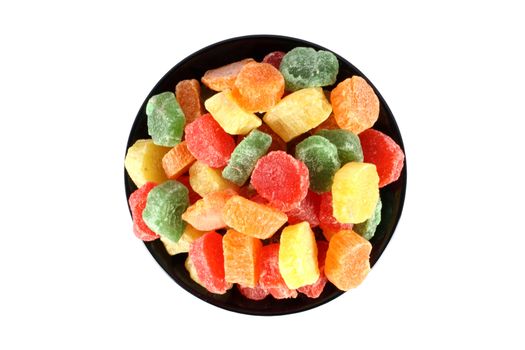 Colorful jelly candies in a black bowl isolated on white