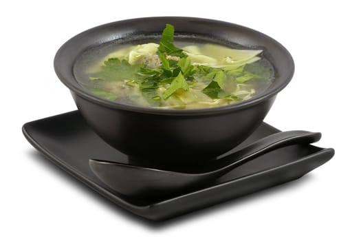 Tasty broth served in stylish; black bowl; on white; isolated