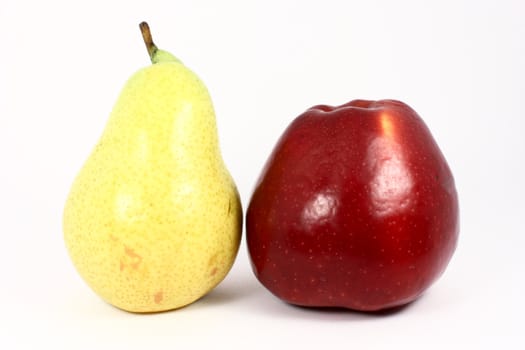 Ripe fresh yellow pear and red apple