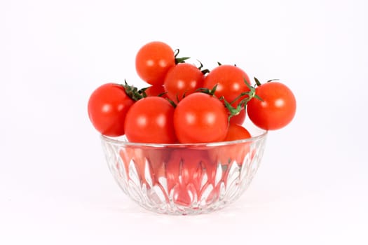 Cherry tomato in glass bowl isolated on white