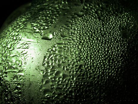 Water drops on a bottle