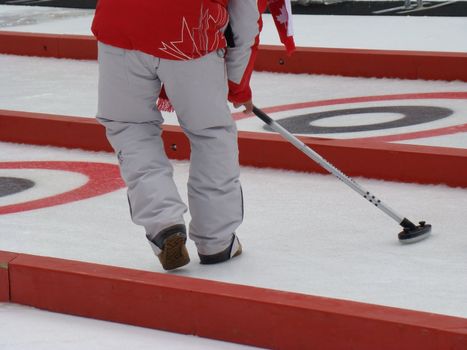 Canadian curling team sweeps the rocks down the rink