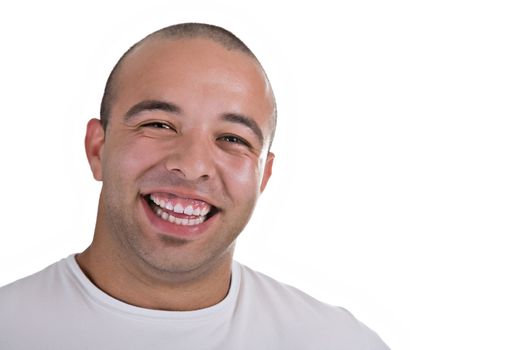 Casual portrait of a young man smiling, over white background.