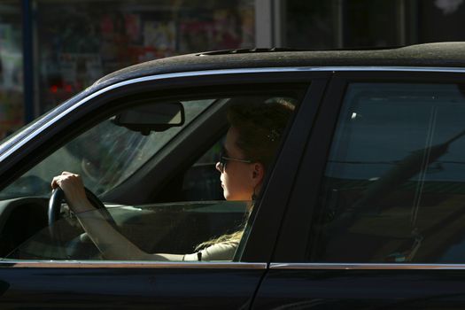 The image of the girl sitting in car