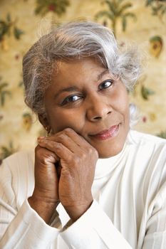 Portrait of mature African American woman looking at viewer.