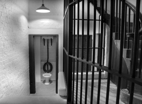 Old toilet in prison cell block dating back to 1854 in monochrome