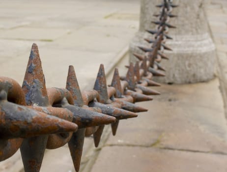 Close up of rusted spiked iron railings