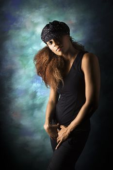 Studio portrait of hip African-American young adult woman looking at viewer.