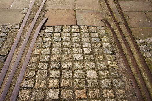 Old disused tram tracks with granite cobbles inlay