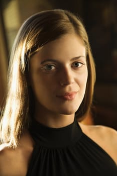 Close-up portrait of smiling young caucasian woman.