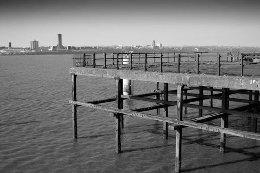 Old rusting metal pier in monochrome