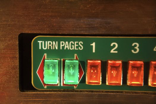 Close-up of jukebox play buttons.