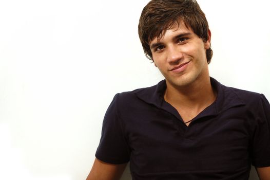 Portrait of handsome hispanic teenager smiling - isolated