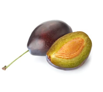 Halved plum on white background