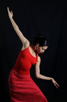 Portrait of hispanic flamenco dancer girl isolated on black