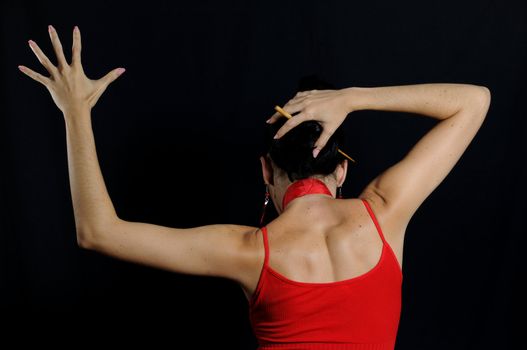 Portrait of passionate flamenco dancer isolated on black