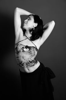Portrait of young woman in contemporary dance pose