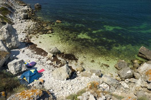 tents camp on the rocky sea coast