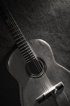 Black and white still life with old acoustic guitar