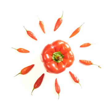 Arrangement of red peppers isolated over white