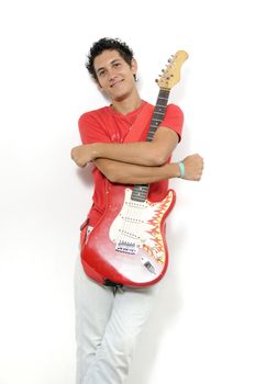 Young musician holding his electric guitar - isolated