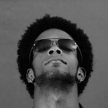 Portrait of young african man wearing sunglasses in black and white