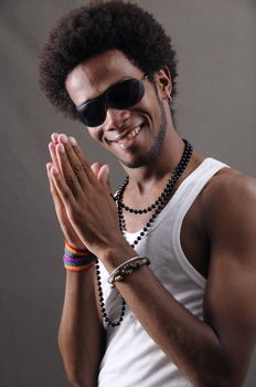 Portrait of young trendy african american male with happy expression