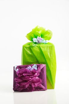 Two gift boxed wrapped in colorful papers - isolated