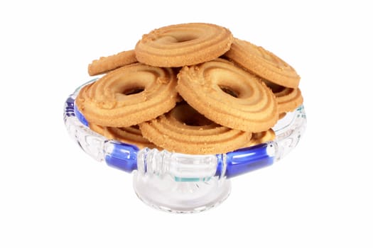 Tee biscuits in glass bowl, isolated on white