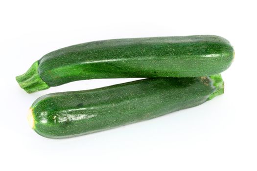 Two ripe zucchini, isolated on white