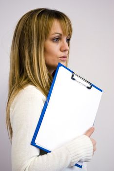 attractive businesswoman holding blank papers and going to a meeting