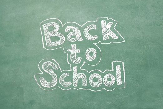 large XXL image of an old chalkboard with the phrase Back to school written on it