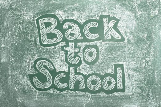 large XXL image of an old chalkboard with Back to school written on it