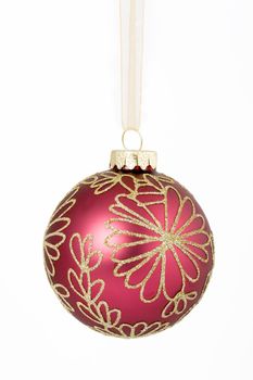 Christmas bauble hanging from a gold ribbon