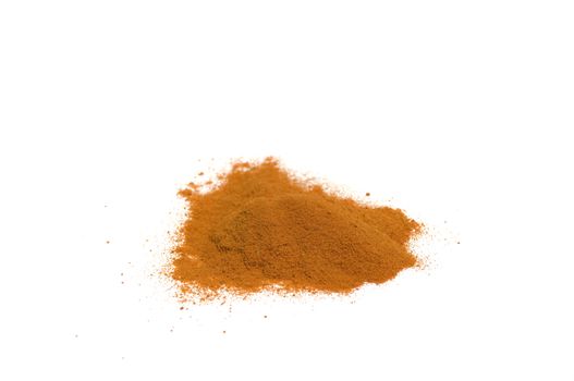 close up on a heap of hot chili powder, isolated on white