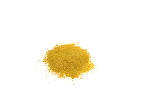 close-up on a heap of curry powder, isolated on white