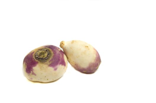 two fresh from the garden turnips, isolated on white