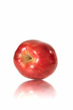 Red apple on the polished surface