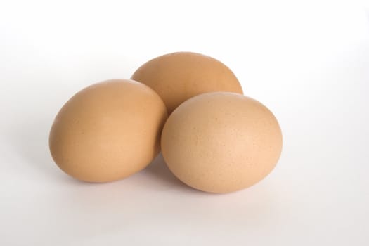 Three eggs on a white background