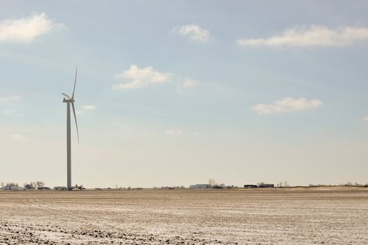 Indiana Wind Turbine turns while traffic passes by