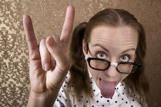Cute Nerdy Girl Making Bull Horns Gesture
