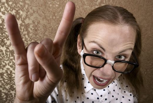 Cute Nerdy Girl Making Bull Horns Gesture