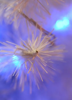 Background of an artificial white fur-tree with fires