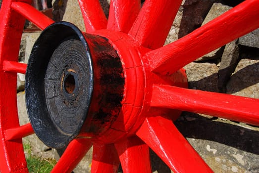 closeup of a red and black painted cartwheel